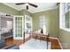Cozy sunroom boasts ample natural light, stylish furnishings, and easy access to the main living area at 1809 The Plaza None, Charlotte, NC 28205