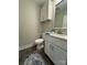 Cozy half bath features a stylish mirror, granite countertop, modern vanity, and a patterned rug at 2012 Crown Point Dr # A, Albemarle, NC 28001