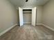 Bedroom with a closet, offering a clean and minimalist design with neutral tones at 2012 Crown Point Dr # A, Albemarle, NC 28001