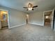 Bedroom boasting plush carpeting, with entries to the bath, walk-in closet, and another bedroom at 2012 Crown Point Dr # A, Albemarle, NC 28001