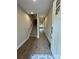 Bright entryway with wood-look flooring, a staircase, and an open view into the living spaces at 2012 Crown Point Dr # A, Albemarle, NC 28001