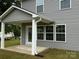 Covered patio with white support columns and a view of green grass at 2012 Crown Point Dr # A, Albemarle, NC 28001