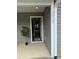 Inviting front entrance featuring a white door, modern siding, and the house number displayed prominently at 2012 Crown Point Dr # A, Albemarle, NC 28001