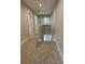 Hallway with carpet leading to staircase, bedrooms, and full bathroom at 2012 Crown Point Dr # A, Albemarle, NC 28001