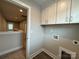 Upstairs laundry area with cabinets at 2012 Crown Point Dr # A, Albemarle, NC 28001