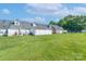 Large green backyard with privacy fence, perfect for outdoor entertaining and relaxation at 2153 Pavilion Ct, Rock Hill, SC 29732