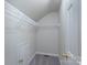 Walk-in closet featuring white wire shelving and a carpet floor, ready for organization at 2153 Pavilion Ct, Rock Hill, SC 29732