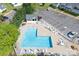 Relaxing community pool area featuring ample seating, a shaded cabana, and landscaped surroundings at 2153 Pavilion Ct, Rock Hill, SC 29732