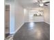 Spacious living room with a modern ceiling fan, and neutral walls, leading into the kitchen and bathroom at 2153 Pavilion Ct, Rock Hill, SC 29732