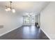 Open living room with modern ceiling fan, dark floors, and bright natural light at 2153 Pavilion Ct, Rock Hill, SC 29732