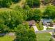 Aerial view of the home with driveway and lush greenery at 227 Country Club Cir, Shelby, NC 28150