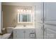 Bright bathroom featuring white cabinets and a marble countertop at 227 Country Club Cir, Shelby, NC 28150
