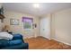 Bright bedroom featuring hardwood floors and a closet at 227 Country Club Cir, Shelby, NC 28150