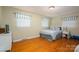 Cozy bedroom featuring hardwood floors and blue accents at 227 Country Club Cir, Shelby, NC 28150