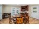 Dining room features a wooden table, a cabinet with a TV, and ample lighting at 227 Country Club Cir, Shelby, NC 28150