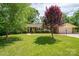 Charming brick ranch home with a well-maintained lawn, mature trees, and tidy landscaping at 227 Country Club Cir, Shelby, NC 28150