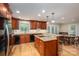 Spacious kitchen featuring wood cabinets, granite countertops, an island, and a breakfast nook at 227 Country Club Cir, Shelby, NC 28150