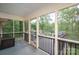Cozy screened-in porch with an outdoor grill and seating with views of a green backyard at 227 Country Club Cir, Shelby, NC 28150
