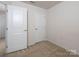 Bedroom featuring neutral carpet and a white door at 2448 Mariners Cove Ln, Denver, NC 28037