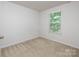 Bedroom with neutral carpet, a window with blinds, and ample natural light at 2448 Mariners Cove Ln, Denver, NC 28037