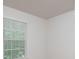 Bright bedroom featuring a large window with blinds at 2448 Mariners Cove Ln, Denver, NC 28037