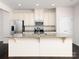Kitchen island with granite countertop and white cabinets at 2448 Mariners Cove Ln, Denver, NC 28037