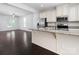 Modern kitchen with granite countertops, stainless steel appliances, and cream cabinetry at 2448 Mariners Cove Ln, Denver, NC 28037