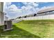 Spacious backyard featuring a well-maintained lawn and a pristine white fence, perfect for outdoor activities and privacy at 2608 Wild Azalea Ct # 9, Monroe, NC 28110