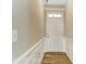 Inviting entryway with wood-look floors, wainscotting and a transom window above the front door, creates a bright and welcoming space at 2608 Wild Azalea Ct # 9, Monroe, NC 28110