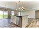 Well-designed kitchen featuring a spacious island, stainless steel appliances, and an open layout, perfect for Gathering gatherings at 2608 Wild Azalea Ct # 9, Monroe, NC 28110