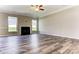 Spacious living room with a fireplace, large windows, and wood-look flooring, ideal for entertaining and relaxing at 2608 Wild Azalea Ct # 9, Monroe, NC 28110