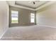 Generous main bedroom with large windows and plush carpeting, creating a private and comfortable retreat at 2608 Wild Azalea Ct # 9, Monroe, NC 28110