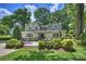 This backyard features an outdoor patio, professional landscaping, and lawn at 2627 Hampton Ave, Charlotte, NC 28207