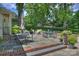 This backyard patio features plenty of seating with professional landscaping at 2627 Hampton Ave, Charlotte, NC 28207