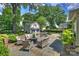 The backyard patio features bluestone pavers, a fire pit, and outdoor seating at 2627 Hampton Ave, Charlotte, NC 28207