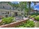 The backyard patio features bluestone pavers, a brick retaining wall, and outdoor seating at 2627 Hampton Ave, Charlotte, NC 28207