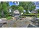 The backyard patio features outdoor seating, fire pit and access to the garage at 2627 Hampton Ave, Charlotte, NC 28207