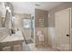 Bright bathroom with new shower doors, and tiled floor at 2627 Hampton Ave, Charlotte, NC 28207