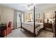 Bedroom with 4-poster bed, and bright natural light at 2627 Hampton Ave, Charlotte, NC 28207