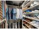 Spacious walk-in closet with custom shelving and racks for shoes, belts, ties, and clothing at 2627 Hampton Ave, Charlotte, NC 28207