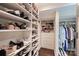 Large walk-in closet with custom shelving and storage solutions for shoes and clothing at 2627 Hampton Ave, Charlotte, NC 28207
