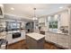 Bright kitchen featuring granite countertops, stainless steel appliances, hardwood floors and a view into the living room at 2627 Hampton Ave, Charlotte, NC 28207