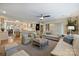 Spacious living room with hardwood floors, neutral furniture, and an open view to the kitchen at 2627 Hampton Ave, Charlotte, NC 28207