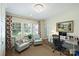 Inviting office area featuring hardwood floors, neutral walls, shuttered windows and a decorative light fixture at 2627 Hampton Ave, Charlotte, NC 28207