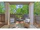 Charming covered back porch with inviting seating, offering a tranquil outdoor retreat at 2906 Hillside Springs Dr, Charlotte, NC 28209