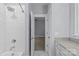 Bright bathroom with tiled shower and granite vanity, offering a clean, modern space at 2906 Hillside Springs Dr, Charlotte, NC 28209