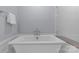 Bright bathroom features a soaking tub and is adorned with neutral tones at 2906 Hillside Springs Dr, Charlotte, NC 28209