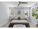 Bright bedroom featuring neutral tones, a ceiling fan, and natural light at 2906 Hillside Springs Dr, Charlotte, NC 28209