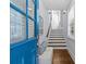 Bright entryway with wood floors, a staircase, bench, and views of the front door at 2906 Hillside Springs Dr, Charlotte, NC 28209