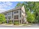 Charming townhome with brick facade, dark shutters, and manicured landscaping at 2906 Hillside Springs Dr, Charlotte, NC 28209